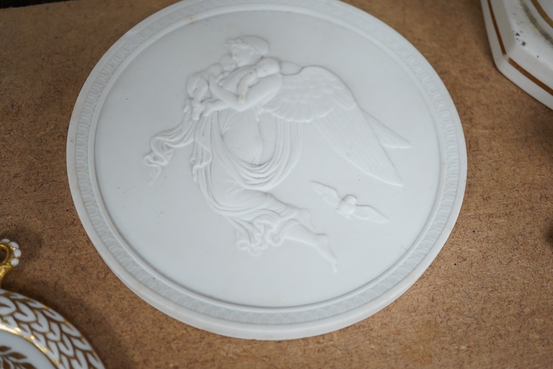 A pair of Copenhagen biscuit porcelain circular plaques, of Night and Day, two smaller French portrait plaques of Emperor Napoleon III and Empress Eugenie , and a Royal Copenhagen Princess Marie commemorative plaque, c.1